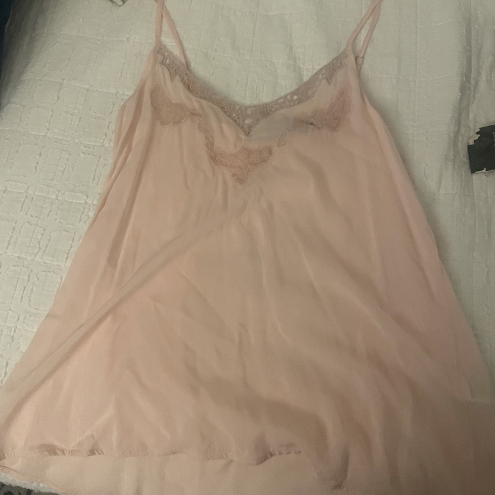 Pink spaghetti strap tank top with stitch and mesh detailing